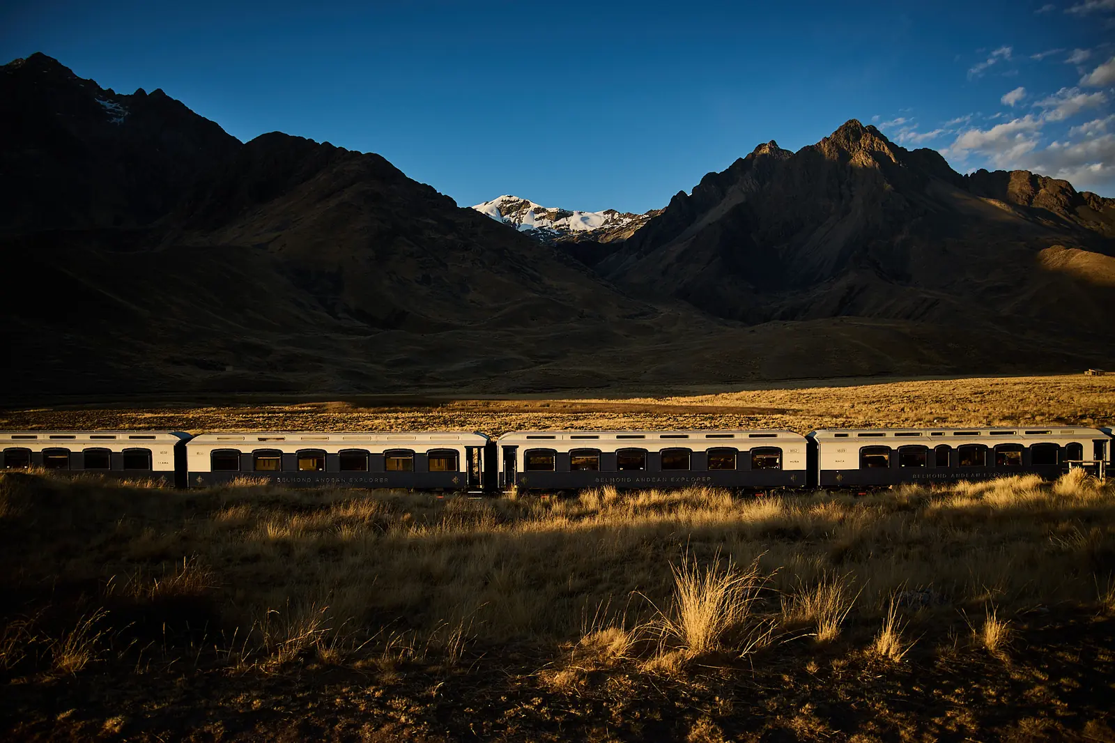 Belmond Andean Explorer train crossing the Peruvian Andes at sunset, by Javier Falcón