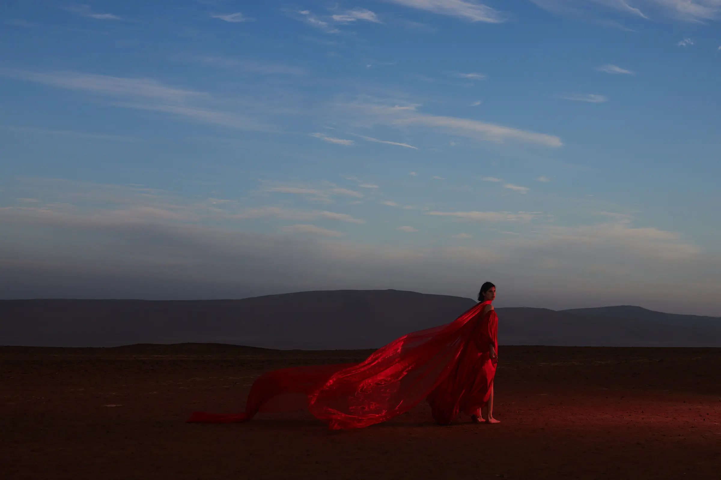 Red dress in the Peruvian coastal desert — fashion editorial by Javier Falcón