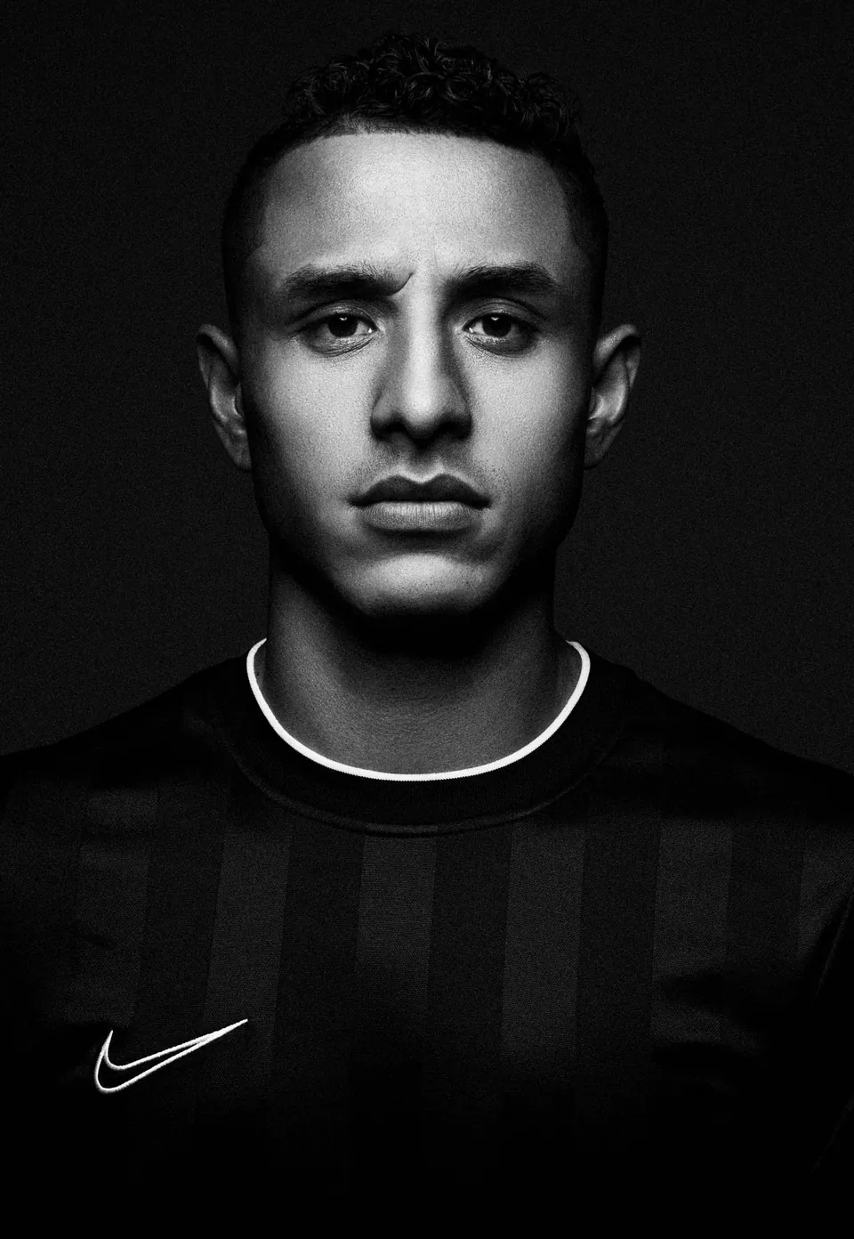 Black-and-white portrait of footballer Yoshimar Yotún for a Nike campaign in Lima, by Javier Falcón