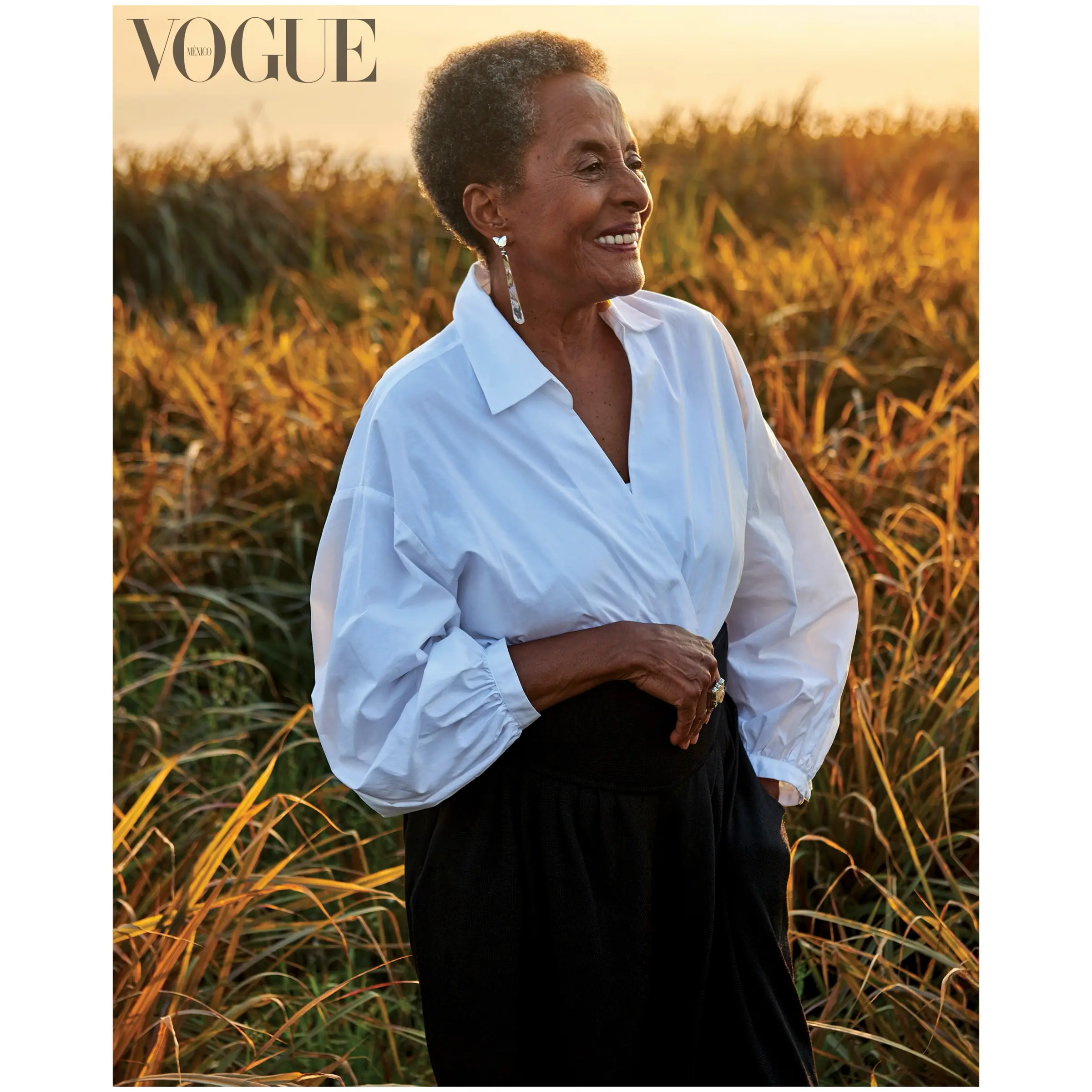 Susana Baca in a sugarcane field at sunset for Vogue México y Latinoamérica, by Javier Falcón